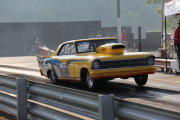 Yellow 1967 Nova Top Sportsman Drag Car Popping Wheelie